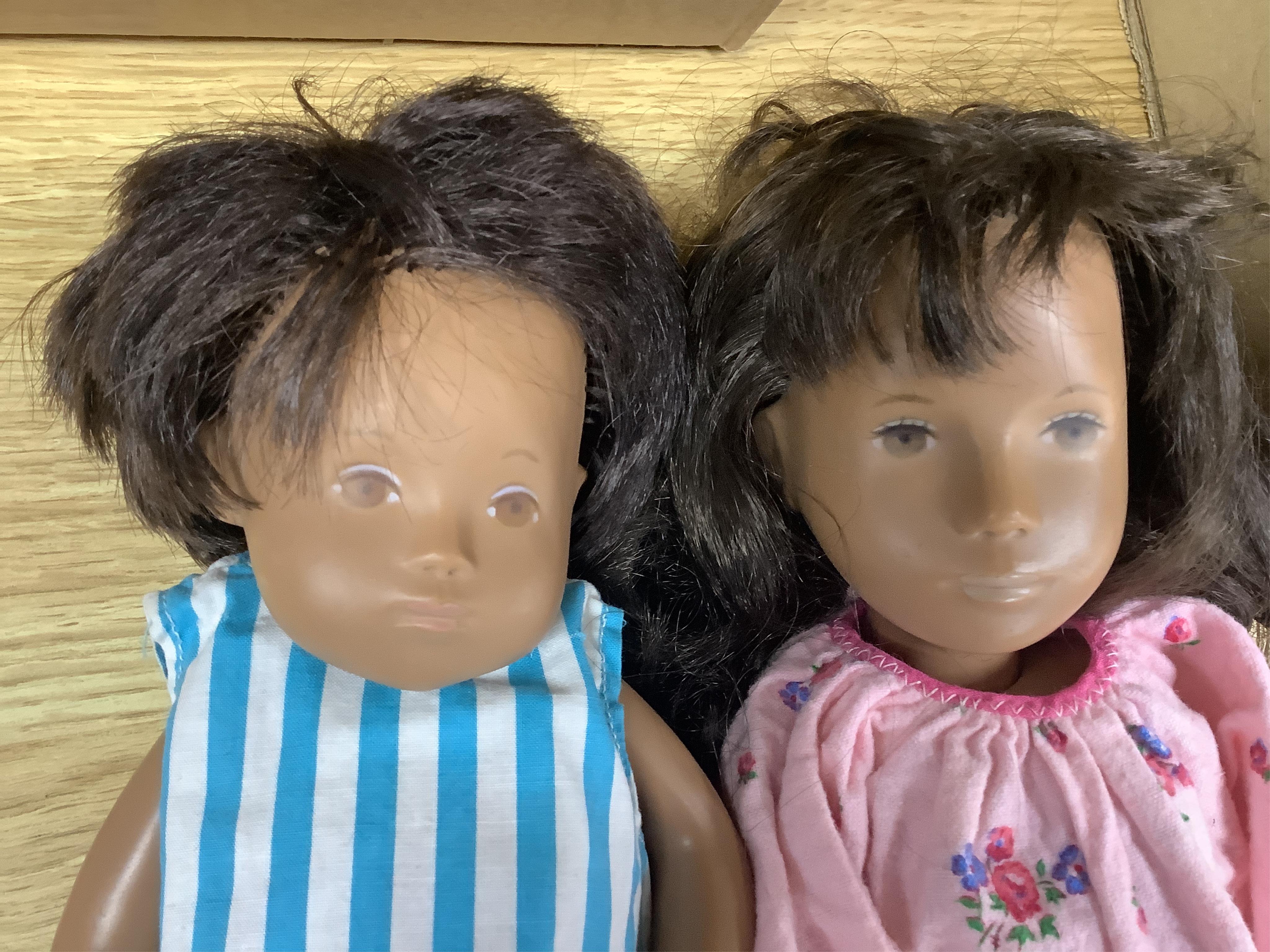 Three Sasha dolls and a quantity of dolls clothing. Condition - good